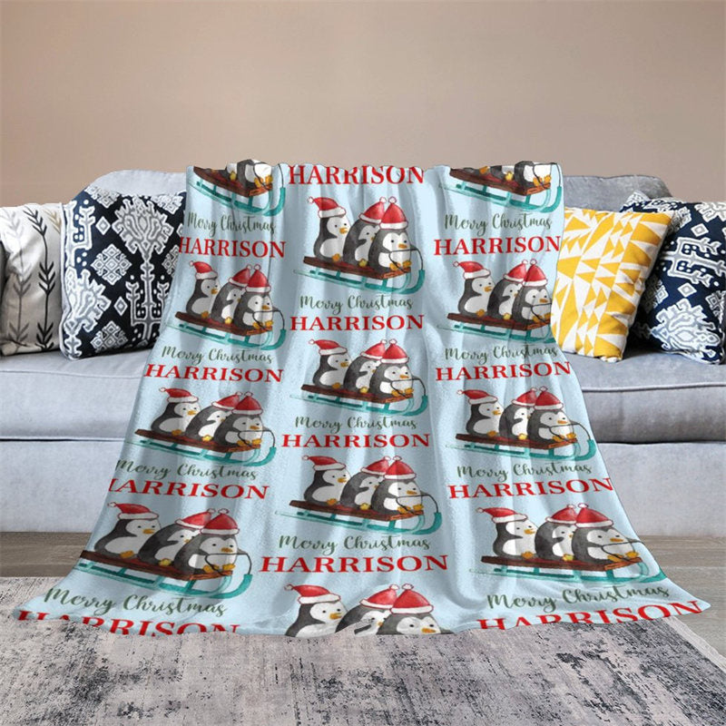 https://www.lofarisbackdrop.com/cdn/shop/files/custom-name-penguin-sleigh-repeat-christmas-blanket-custom-made-free-shipping-548.jpg?v=1700464574