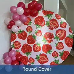 Round decorative cover with a strawberry print pattern and pink and red balloons attached.